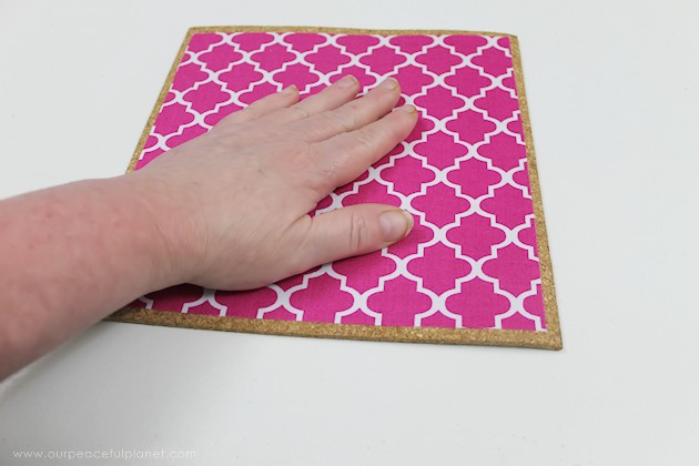 Learn how to make a custom DIY mouse pad in 10 minutes with cork, a bit of material & some spray adhesive. So easy & inexpensive you can make a whole set!