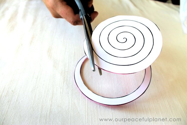 Make these beautiful DIY paper flowers in 5 minutes or less! Use them in your crafts or decorating. Attach them to a lamp shade. Even use them in your hair!
