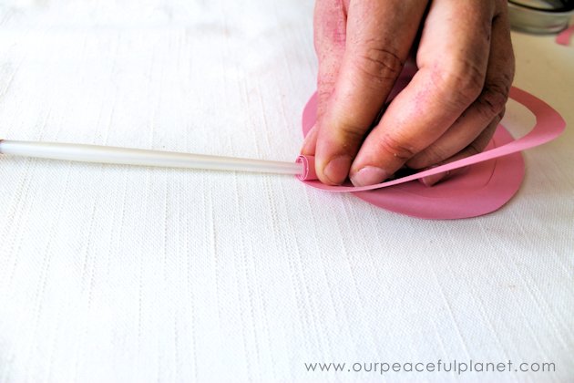 Make these beautiful DIY paper flowers in 5 minutes or less! Use them in your crafts or decorating. Attach them to a lamp shade. Even use them in your hair!