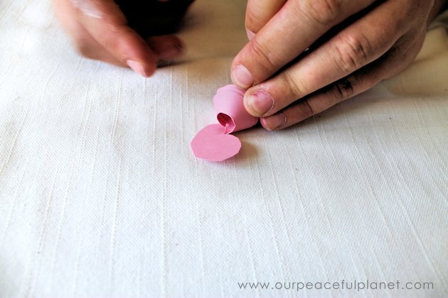 Make these beautiful DIY paper flowers in 5 minutes or less! Use them in your crafts or decorating. Attach them to a lamp shade. Even use them in your hair!