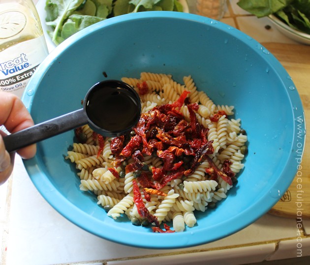 Even if your not a salad eater you will like this arugula, spinach, sun dried tomatoes and capers healthy pasta salad. It's quick to make a very filling!