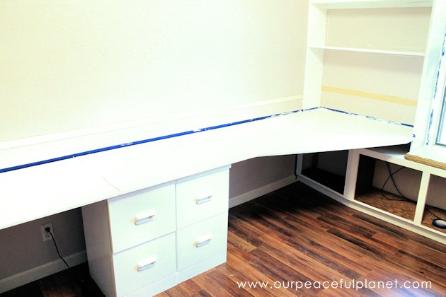 Build a large surface home office desk from inexpensive 3/4" MDF wood. Using items you might already have, no legs are needed. It's easier than you think!