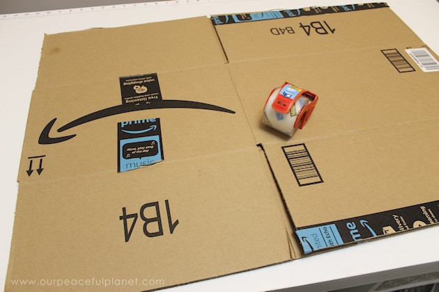 Learn how to make an inexpensive pull out cabinet organizer using a cardboard box so you can easily access things in the far reaches of your lower cabinets.