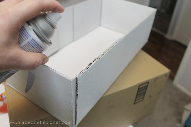 Learn how to make an inexpensive pull out cabinet organizer using a cardboard box so you can easily access things in the far reaches of your lower cabinets.