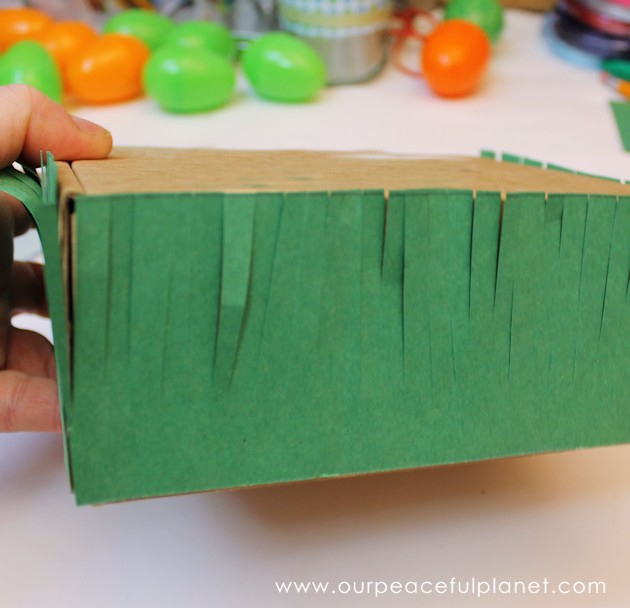 Make this cute carrot garden diy Easter basket using plastic eggs, a box and some construction paper! You can fill the box and the carrot eggs with goodies.