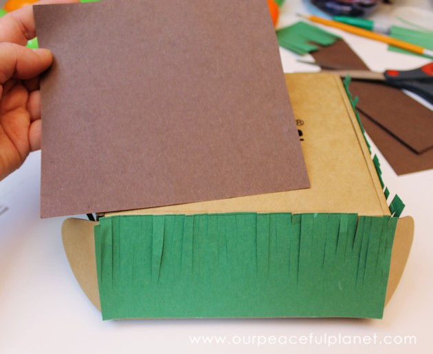 Make this cute carrot garden diy Easter basket using plastic eggs, a box and some construction paper! You can fill the box and the carrot eggs with goodies.
