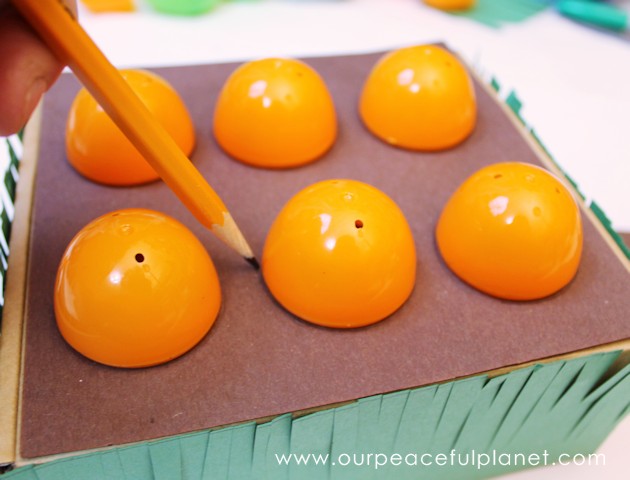 Make this cute carrot garden diy Easter basket using plastic eggs, a box and some construction paper! You can fill the box and the carrot eggs with goodies.