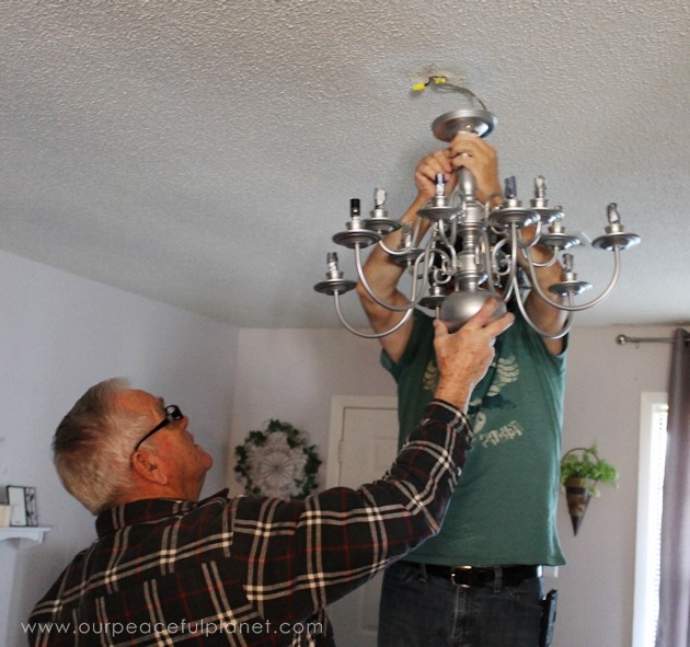 A simple chandelier makeover using a chandelier found at a thrift store. It replaced a ceiling fan in and was flush mounted. The effect was stunning!