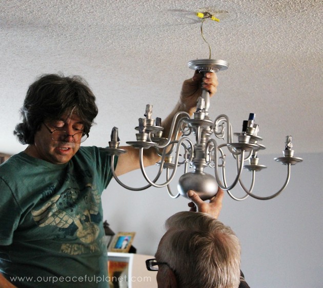 A simple chandelier makeover using a chandelier found at a thrift store. It replaced a ceiling fan in and was flush mounted. The effect was stunning!