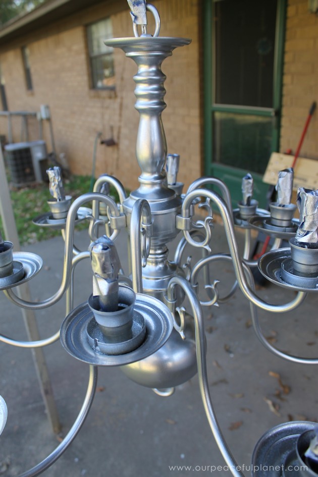 A simple chandelier makeover using a chandelier found at a thrift store. It replaced a ceiling fan in and was flush mounted. The effect was stunning!
