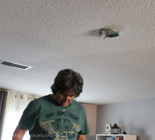 A simple chandelier makeover using a chandelier found at a thrift store. It replaced a ceiling fan in and was flush mounted. The effect was stunning!