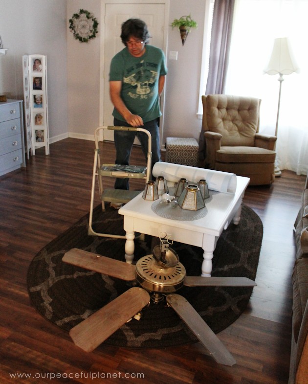 A simple chandelier makeover using a chandelier found at a thrift store. It replaced a ceiling fan in and was flush mounted. The effect was stunning!