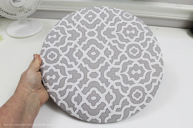 This cheap folding stool from Amazon was for my craft room. It just needed a little love. i.e. paint and material plus a wood circle to make it tad higher. I also added the feature of making the fabric top removable in case I want to change the color at some point.