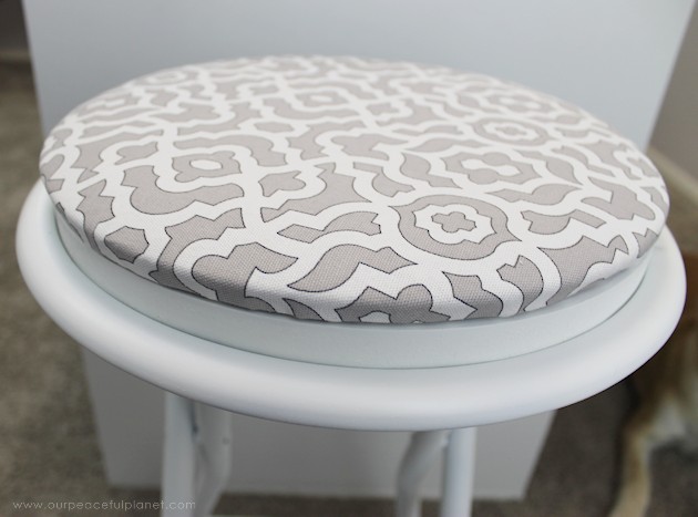 This cheap folding stool from Amazon was for my craft room. It just needed a little love. i.e. paint and material plus a wood circle to make it tad higher. I also added the feature of making the fabric top removable in case I want to change the color at some point.