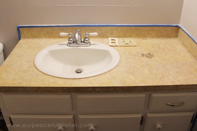Transform your bathroom for only a few dollars with a contact paper countertop. You'll be amazed at how beautiful it looks & so will your family & guests!