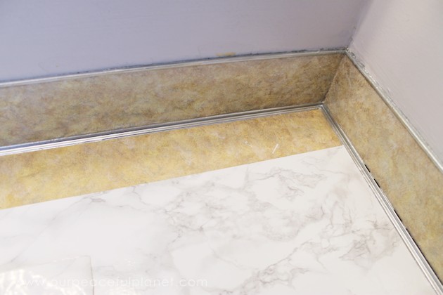Transform your bathroom for only a few dollars with a contact paper countertop. You'll be amazed at how beautiful it looks & so will your family & guests!