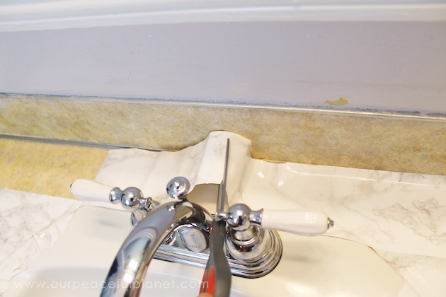 Transform your bathroom for only a few dollars with a contact paper countertop. You'll be amazed at how beautiful it looks & so will your family & guests!