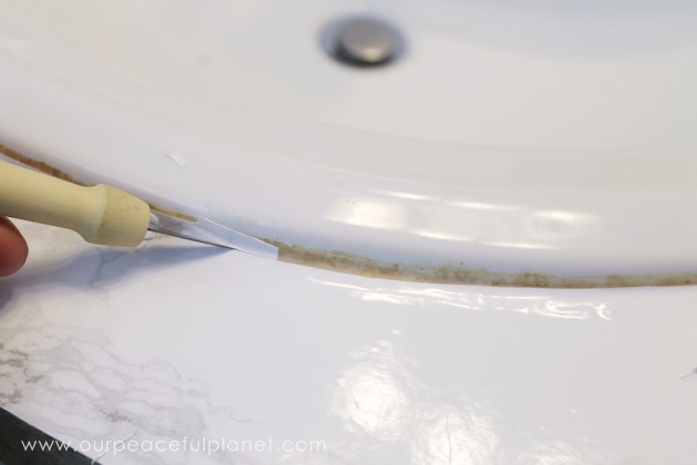 Transform your bathroom for only a few dollars with a contact paper countertop. You'll be amazed at how beautiful it looks & so will your family & guests!