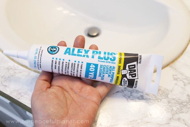 Transform your bathroom for only a few dollars with a contact paper countertop. You'll be amazed at how beautiful it looks & so will your family & guests!