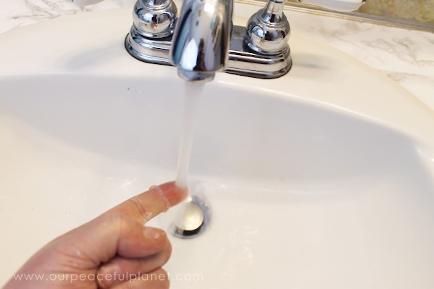 Transform your bathroom for only a few dollars with a contact paper countertop. You'll be amazed at how beautiful it looks & so will your family & guests!