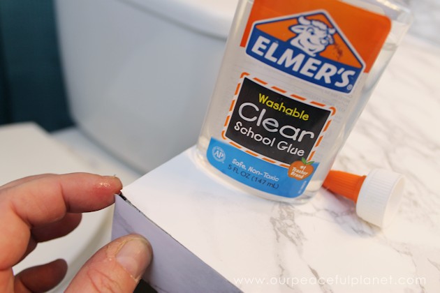 Transform your bathroom for only a few dollars with a contact paper countertop. You'll be amazed at how beautiful it looks & so will your family & guests!