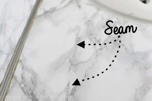 Transform your bathroom for only a few dollars with a contact paper countertop. You'll be amazed at how beautiful it looks & so will your family & guests!
