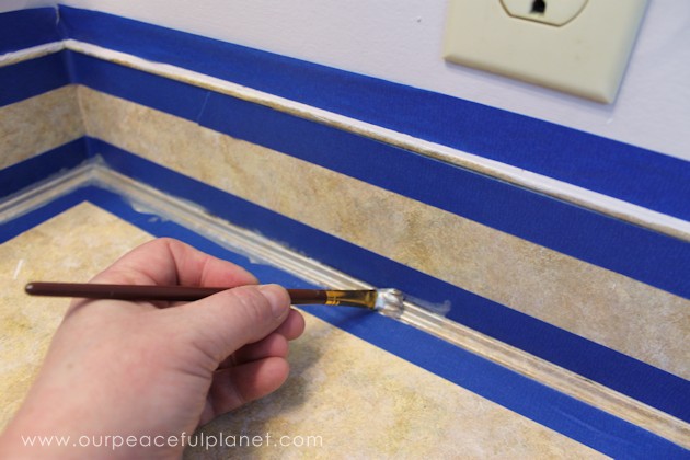 Transform your bathroom for only a few dollars with a contact paper countertop. You'll be amazed at how beautiful it looks & so will your family & guests!