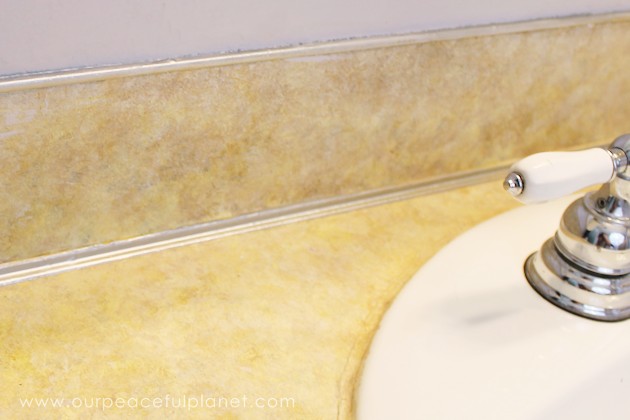 Transform your bathroom for only a few dollars with a contact paper countertop. You'll be amazed at how beautiful it looks & so will your family & guests!