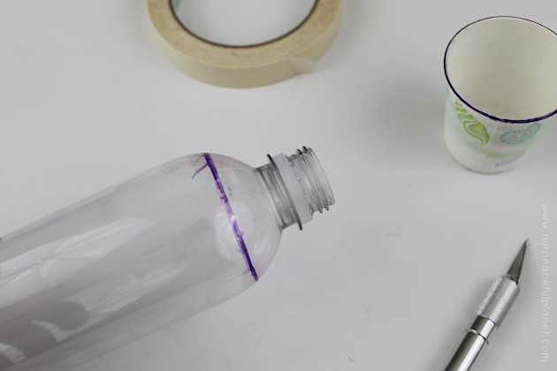 This cup dispenser is part of our matching Contemporary Kitchen Craft series. Hang it anywhere. It works and looks great! Best soda bottle upcycle ever!