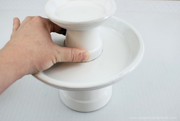 This small DIY cake stand can hold so much more! Fruit, cookies, nuts, candy, tea bags etc. Made from clay pots it’s simple and inexpensive to make. 