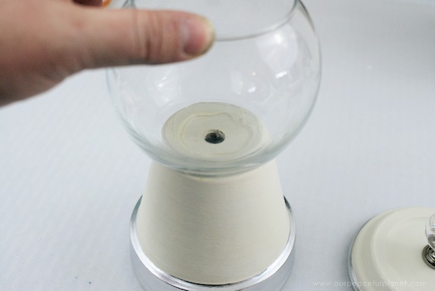 This elegant DIY sugar dispenser will add some beauty to your kitchen. It's made from a clay pot and a glass bowl and is inexpensive and simple to create!