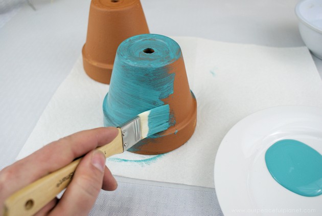 A beautiful gold & teal version of the classic DIY gumball machine, made from a clay pot & a glass bowl. Use it for gum, candy or a variety of other things!