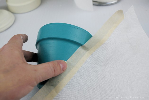 A beautiful gold & teal version of the classic DIY gumball machine, made from a clay pot & a glass bowl. Use it for gum, candy or a variety of other things!