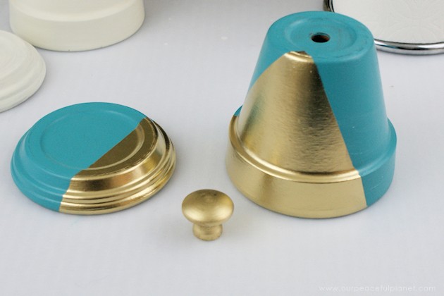 A beautiful gold & teal version of the classic DIY gumball machine, made from a clay pot & a glass bowl. Use it for gum, candy or a variety of other things!