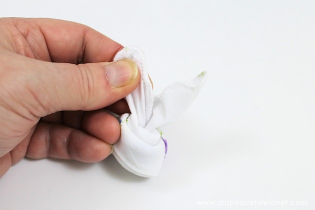 Give your friends a special Easter greetings bunny and beautiful poem made from a simple folded handkerchief or piece of cloth and filled with a golden egg.