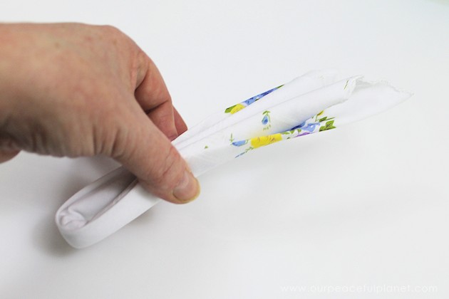 Give your friends a special Easter greetings bunny and beautiful poem made from a simple folded handkerchief or piece of cloth and filled with a golden egg.