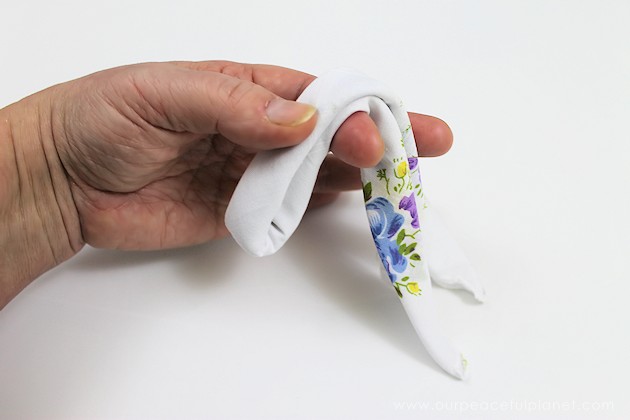 Give your friends a special Easter greetings bunny and beautiful poem made from a simple folded handkerchief or piece of cloth and filled with a golden egg.