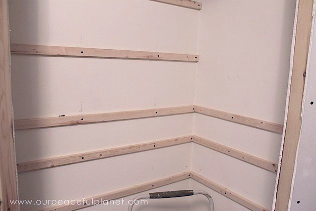 Add space and convenience to your small kitchen with this simple DIY pantry! It has floor to ceiling shelves, a door and it fits perfectly into a corner.