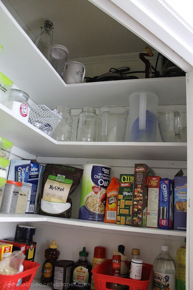 Add space and convenience to your small kitchen with this simple DIY pantry! It has floor to ceiling shelves, a door and it fits perfectly into a corner.