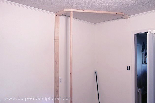 Add space and convenience to your small kitchen with this simple DIY pantry! It has floor to ceiling shelves, a door and it fits perfectly into a corner.