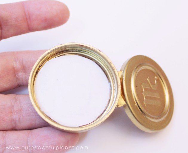 This cute upcycled locket necklace will put a grin on anyone's face and makes a wonderful gift for moms, grandmas or anyone who loves quirky jewelry.
