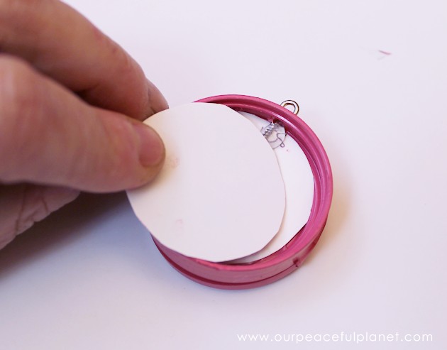 This cute upcycled locket necklace will put a grin on anyone's face and makes a wonderful gift for moms, grandmas or anyone who loves quirky jewelry.