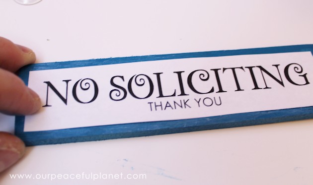 Make these small eye catching wood no soliciting signs that easily hang on windows or doors. A 1.5" wood slat and our free printables will get you started!