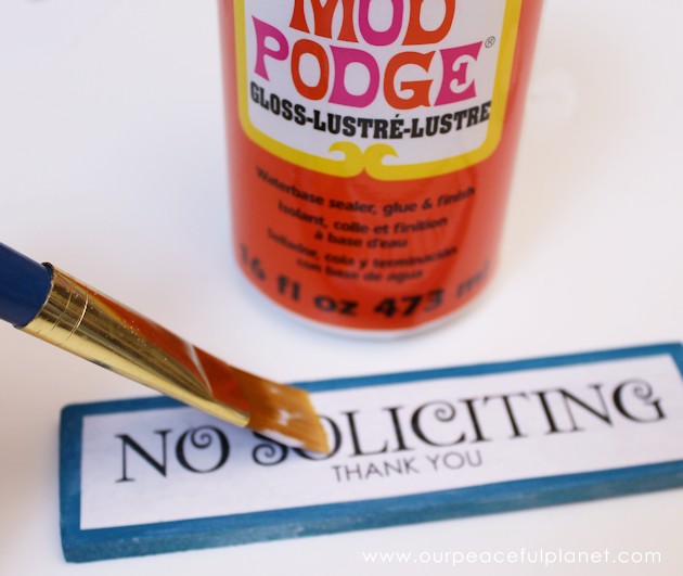 Make these small eye catching wood no soliciting signs that easily hang on windows or doors. A 1.5" wood slat and our free printables will get you started!