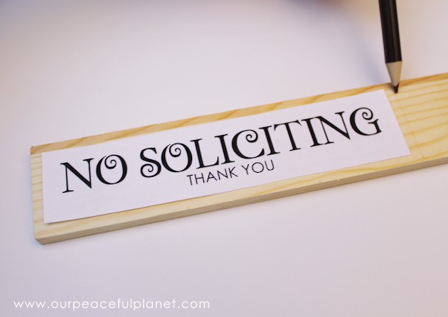 Make these small eye catching wood no soliciting signs that easily hang on windows or doors. A 1.5" wood slat and our free printables will get you started!