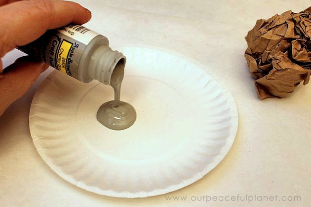 You won't believe how easy & inexpensive it is to do a dramatic fireplace makeover! All you need is some normal paint and a wadded up paper bag. No kidding!