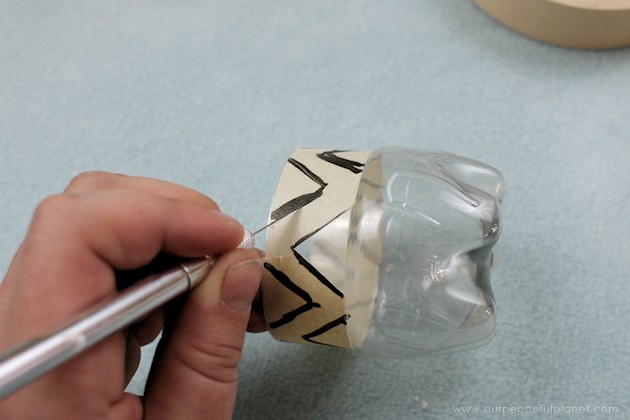 Make your outdoor pathways shine and glimmer with these elegant gold and silver path lights made from soda bottles, dowels and battery operated tea lights.