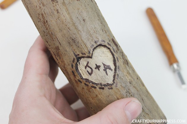 If you're looking for a unique gift idea for couples this darling carved sweetheart branch is perfect and inexpensive. You can make it with a couple of carving tools, which are cheap, and a marker. Or if you happen to own a rotary or Dremel tool and/or a wood burner, you can use those. We show both ways of making it.