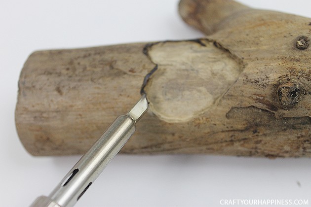 If you're looking for a unique gift idea for couples this darling carved sweetheart branch is perfect and inexpensive. You can make it with a couple of carving tools, which are cheap, and a marker. Or if you happen to own a rotary or Dremel tool and/or a wood burner, you can use those. We show both ways of making it.