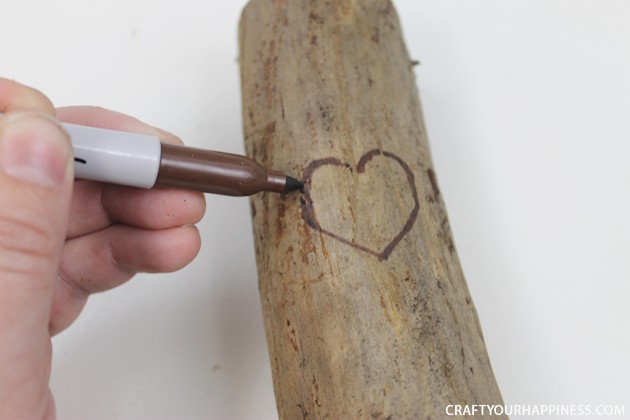 If you're looking for a unique gift idea for couples this darling carved sweetheart branch is perfect and inexpensive. You can make it with a couple of carving tools, which are cheap, and a marker. Or if you happen to own a rotary or Dremel tool and/or a wood burner, you can use those. We show both ways of making it.